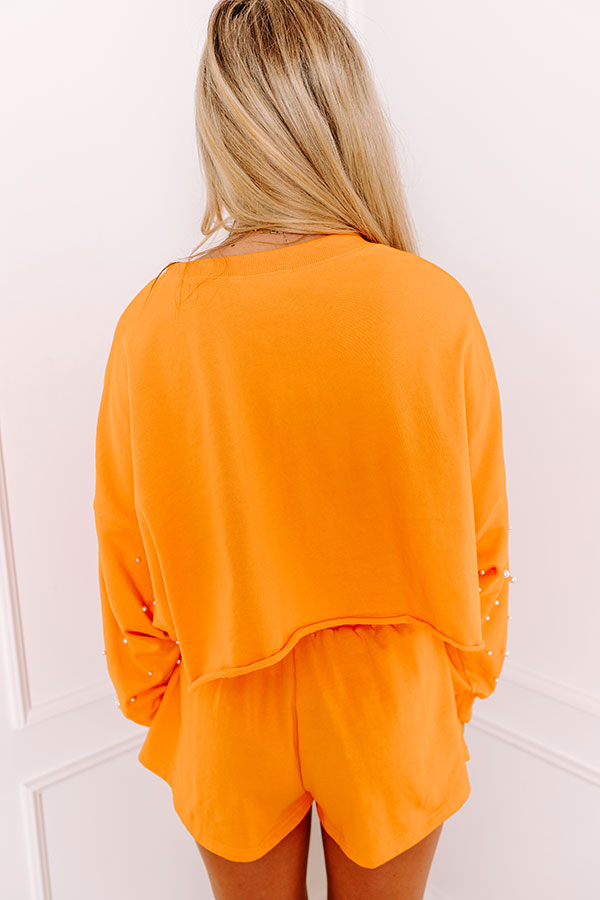 Ultimate Sideline Glam: Orange Pearl-Embellished Crop Sweatshirt