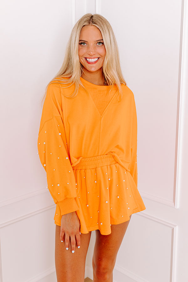 Ultimate Sideline Glam: Orange Pearl-Embellished Crop Sweatshirt